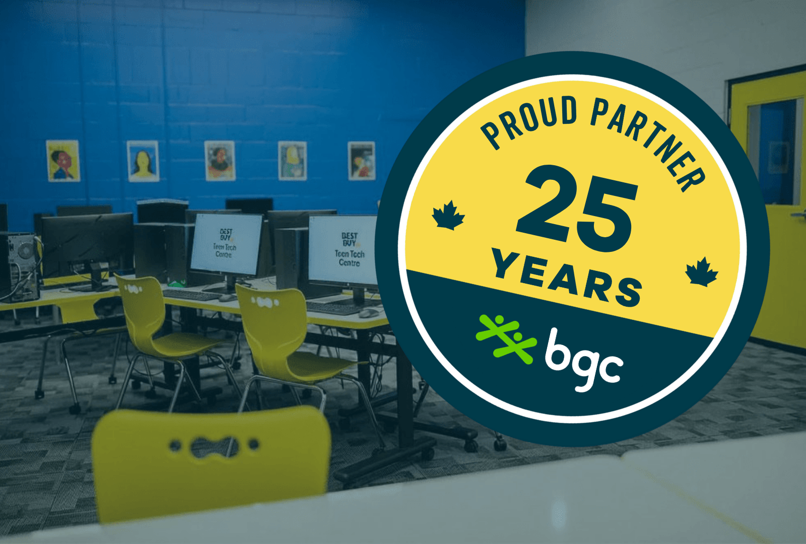 Best Buy Website - Partner Anniversary Graphic (1) A computer lab room with bright blue walls and yellow chairs, overlaid with a circular badge that reads "Proud Partner 25 Years" alongside the BGC logo.