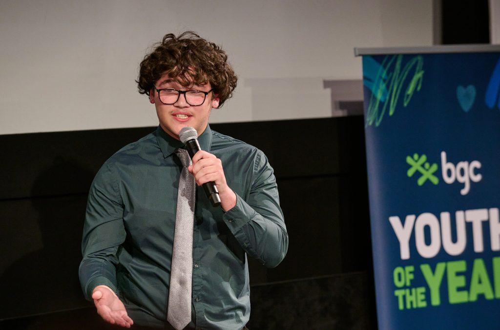 Teenager speaking on a microphone
